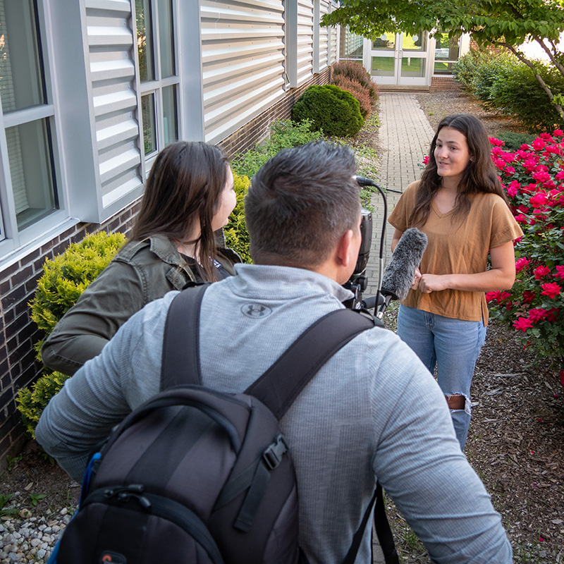 A teen is interviewed for a project